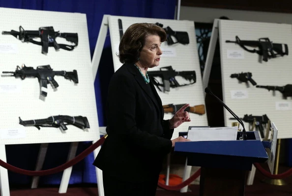 U.S. Senator Dianne Feinstein (D-CA) speaks next to a display of assault weapons during a news conference January 24, 2013 on Capitol Hill in Washington, DC. U.S. Senator Dianne Feinstein (D-CA) speaks next to a display of assault weapons during a news conference January 24, 2013 on Capitol Hill in Washington, DC.